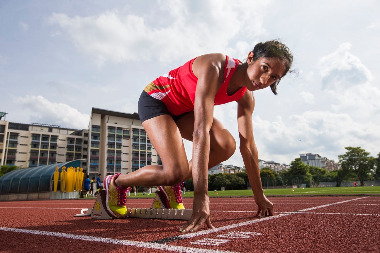 Shanti Pereira, Singapore's sprint queen and Olympian, looking at the camera, getting ready for a sprint