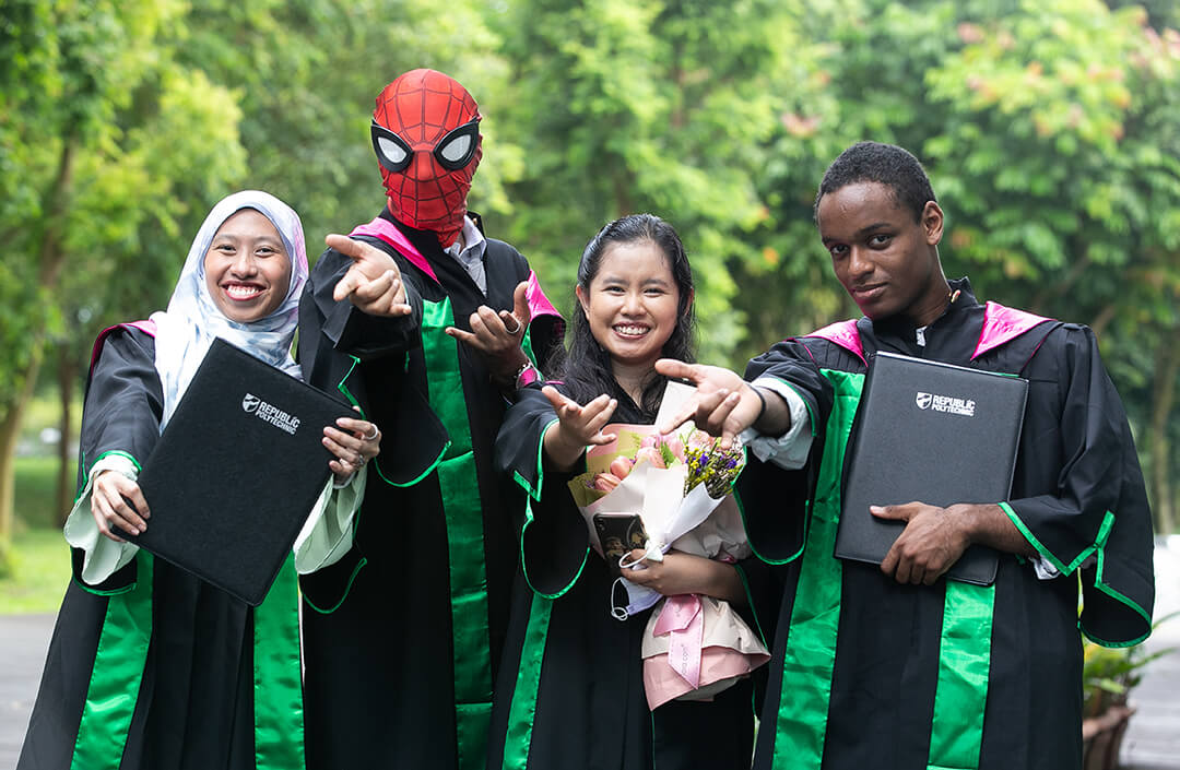 Spiderman attends graduation with friends