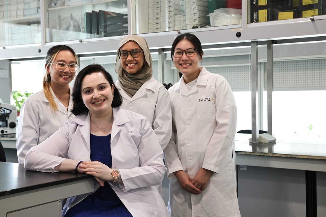 Ms Malini and her students in the lab