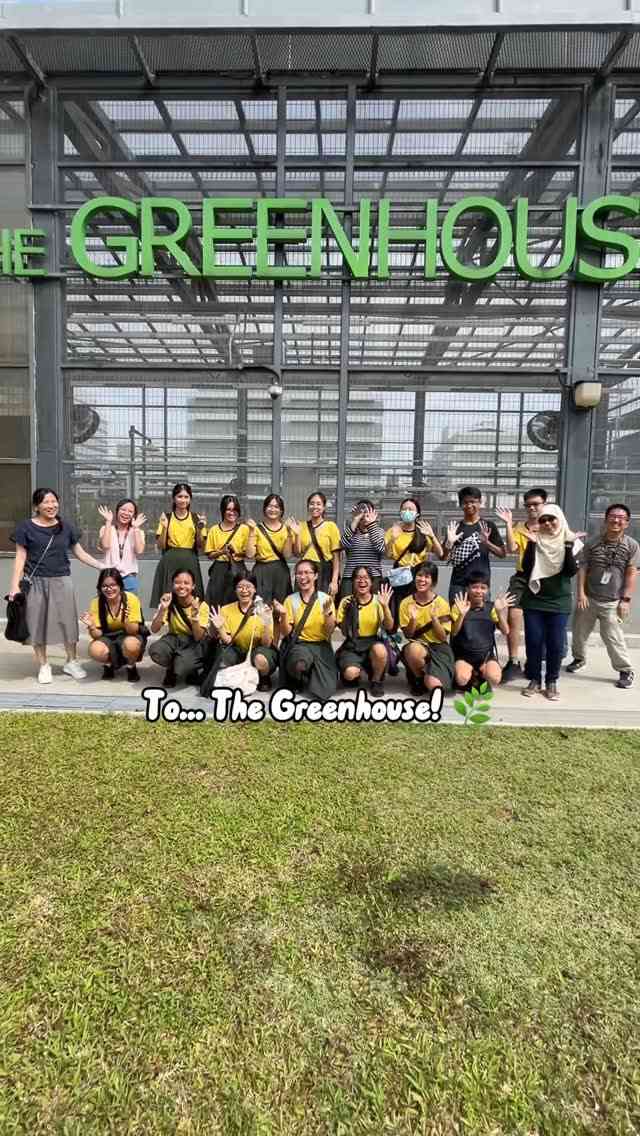 A group of students and teachers posing cheerfully in front of Republic Polytechnic’s Greenhouse, with the caption “To… The Greenhouse!” and a sunny, outdoor backdrop.