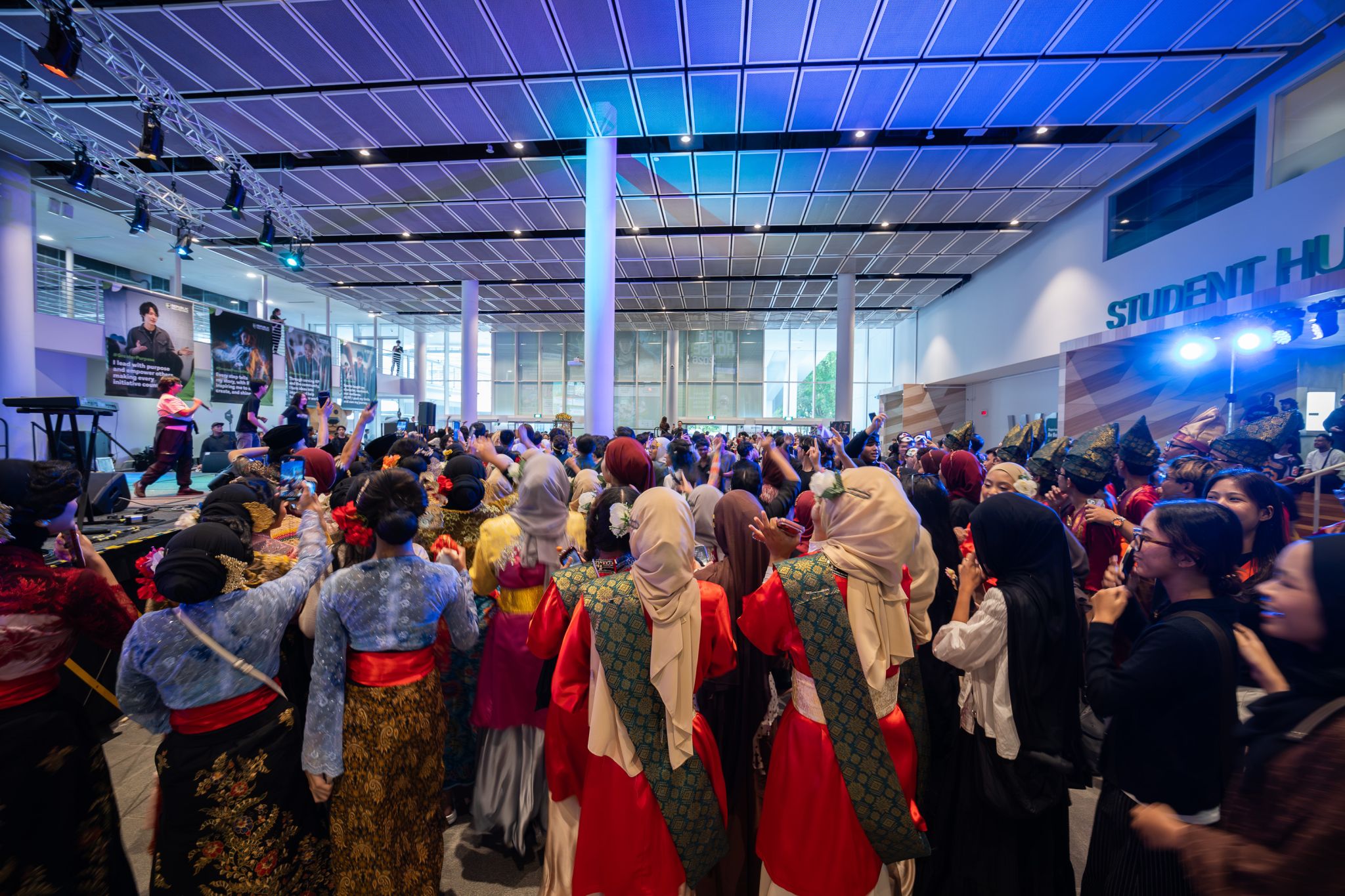 Student performers gathering around South Agora Stage