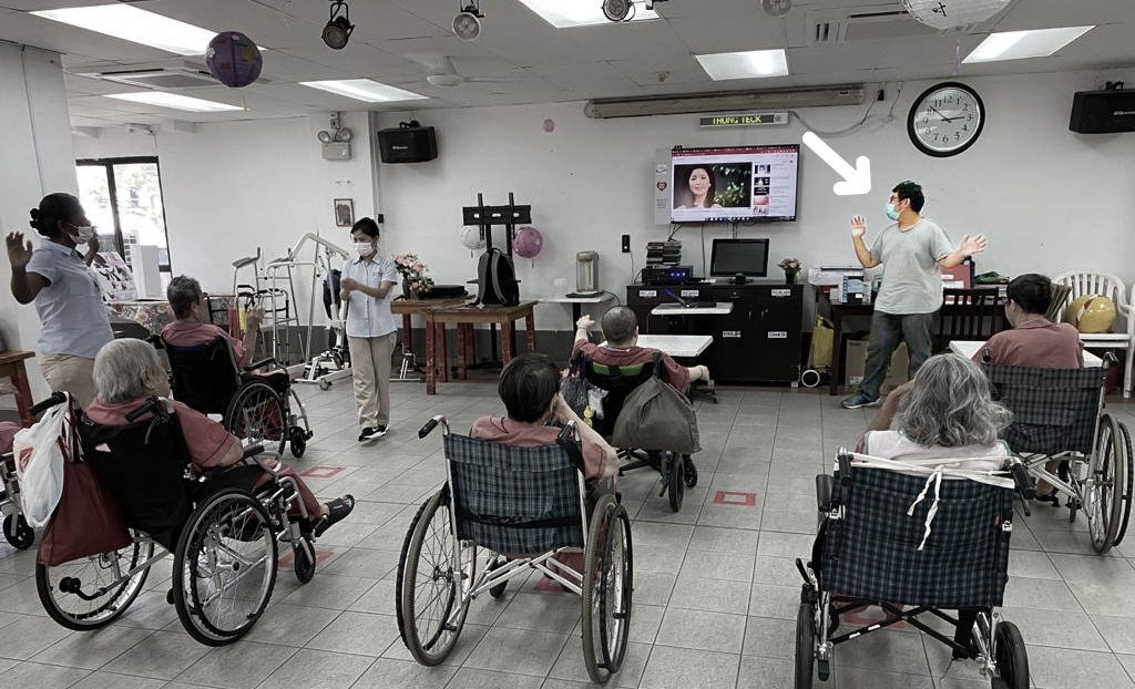 Lionel and fellow volunteers facilitating a Zumba workout for seniors at the Humanist Society Mid-Autumn Festival celebrations