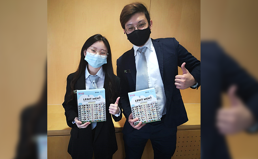 Cordelia Hyeeun Hwang and Ong Peng Kai with one of their projects – an augmented reality card game which seeks to create awareness on various risks associated with online activities and fake news