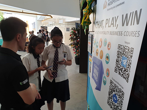 Students trying out School of Hospitality’s very own Digital Course Counsellor, Sohphia!